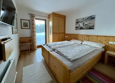 Ein Bett oder Betten in einem Zimmer der Unterkunft Almhäuser Filzsteinalpe Almhaus 206