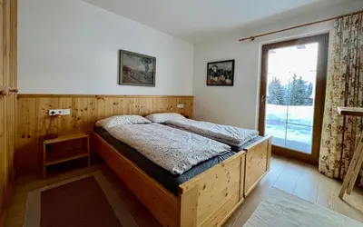 Ein Bett oder Betten in einem Zimmer der Unterkunft Almhäuser Filzsteinalpe Almhaus 206