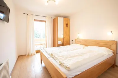 Ein Bett oder Betten in einem Zimmer der Unterkunft Almhäuser Filzsteinalpe Almhaus 205