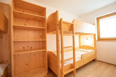 Ein Bett oder Betten in einem Zimmer der Unterkunft Almhäuser Filzsteinalpe Almhaus 205