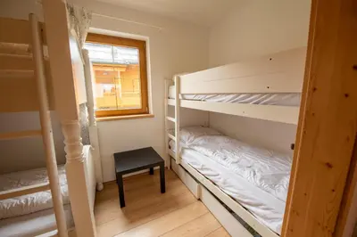 Ein Bett oder Betten in einem Zimmer der Unterkunft Almhäuser Filzsteinalpe Almhaus 198