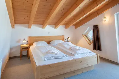 Ein Bett oder Betten in einem Zimmer der Unterkunft Haus 131 Top 3