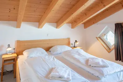 Ein Bett oder Betten in einem Zimmer der Unterkunft Haus 131 Top 3