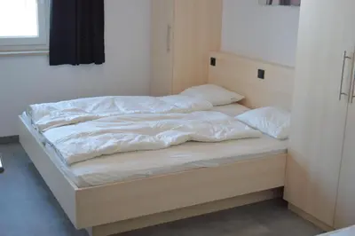 Ein Bett oder Betten in einem Zimmer der Unterkunft Arena Juwel 104 Top 2