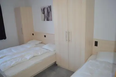 Ein Bett oder Betten in einem Zimmer der Unterkunft Arena Juwel 104 Top 2