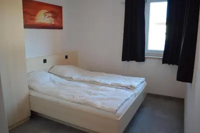 Ein Bett oder Betten in einem Zimmer der Unterkunft Arena Juwel 104 Top 2