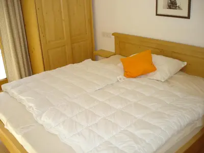 Ein Bett oder Betten in einem Zimmer der Unterkunft Almhäuser Filzsteinalpe Almhaus 202