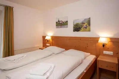 Ein Bett oder Betten in einem Zimmer der Unterkunft Almhäuser Filzsteinalpe Almhaus 196