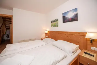 Ein Bett oder Betten in einem Zimmer der Unterkunft Almhäuser Filzsteinalpe Almhaus 196