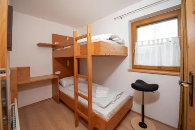 Ein Bett oder Betten in einem Zimmer der Unterkunft Almhäuser Filzsteinalpe Almhaus 196