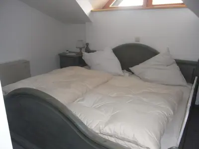 Ein Bett oder Betten in einem Zimmer der Unterkunft Haus Winterland Top 5