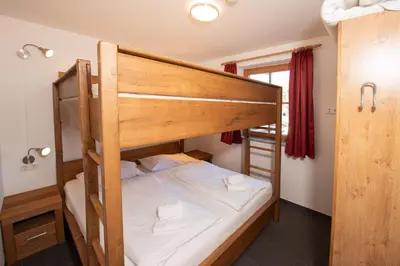 Ein Bett oder Betten in einem Zimmer der Unterkunft Duxeranger E Top 3