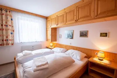 Ein Bett oder Betten in einem Zimmer der Unterkunft Chalet Alpine Royal A Top 2