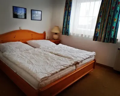 Ein Bett oder Betten in einem Zimmer der Unterkunft Haus 129 Top 1