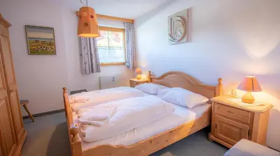 Ein Bett oder Betten in einem Zimmer der Unterkunft Chalet Alpine Royal B Top 16