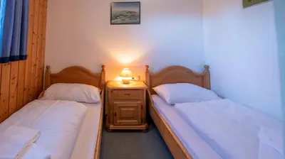 Ein Bett oder Betten in einem Zimmer der Unterkunft Chalet Alpine Royal B Top 16