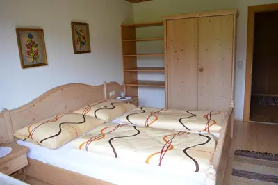 Ein Bett oder Betten in einem Zimmer der Unterkunft Schusterhof