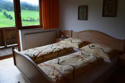 Ein Bett oder Betten in einem Zimmer der Unterkunft Schusterhof