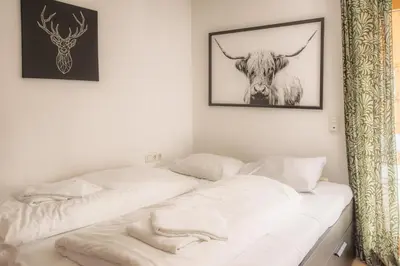 Ein Bett oder Betten in einem Zimmer der Unterkunft Almhäuser Filzsteinalpe Almhaus 197