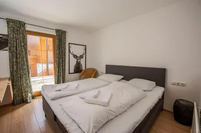 Ein Bett oder Betten in einem Zimmer der Unterkunft Almhäuser Filzsteinalpe Almhaus 197