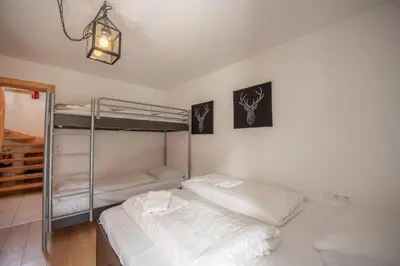 Ein Bett oder Betten in einem Zimmer der Unterkunft Almhäuser Filzsteinalpe Almhaus 197