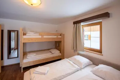 Ein Bett oder Betten in einem Zimmer der Unterkunft Almhäuser Filzsteinalpe Almhaus 204