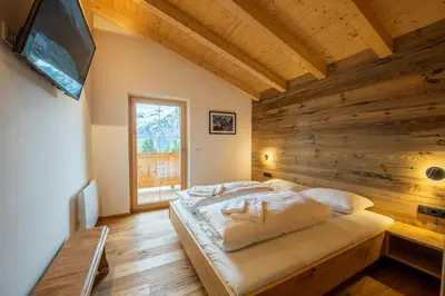 Ein Bett oder Betten in einem Zimmer der Unterkunft Filzsteinresort Chalets Chalet Bergankunft 236
