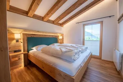 Ein Bett oder Betten in einem Zimmer der Unterkunft Filzsteinresort Chalets - Chalet 238