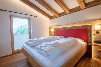 Ein Bett oder Betten in einem Zimmer der Unterkunft Filzsteinresort Chalets - Chalet 238