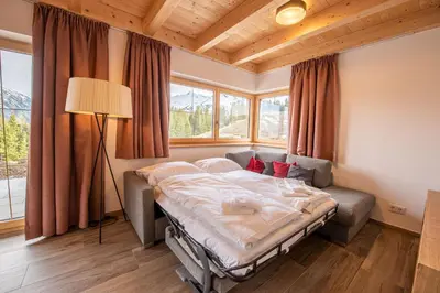 Ein Bett oder Betten in einem Zimmer der Unterkunft Filzsteinresort Chalets - Chalet 239