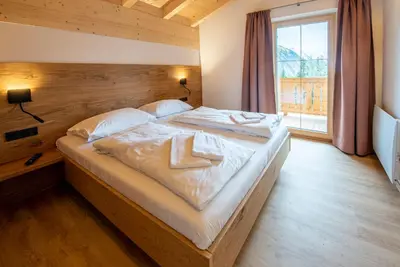 Ein Bett oder Betten in einem Zimmer der Unterkunft Filzsteinresort Chalets - Chalet 239