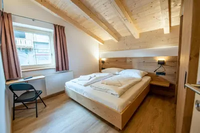 Ein Bett oder Betten in einem Zimmer der Unterkunft Filzsteinresort Chalets - Chalet 239