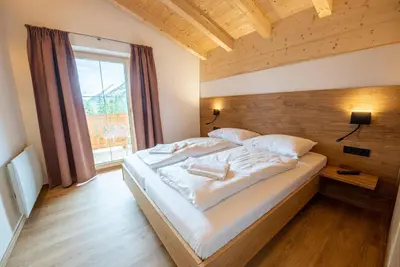 Ein Bett oder Betten in einem Zimmer der Unterkunft Filzsteinresort Chalets - Chalet 239
