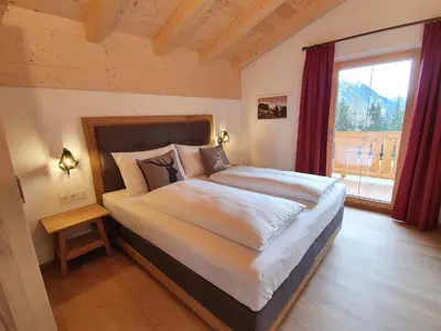 Ein Bett oder Betten in einem Zimmer der Unterkunft Filzsteinresort Chalets - Chalet 240