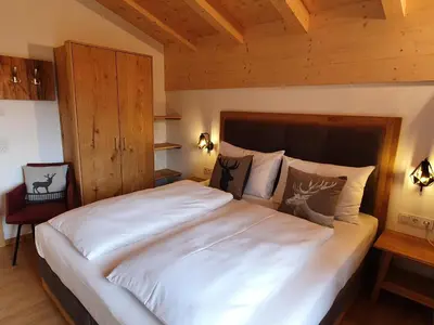 Ein Bett oder Betten in einem Zimmer der Unterkunft Filzsteinresort Chalets - Chalet 240