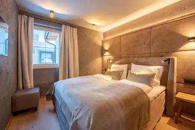 Ein Bett oder Betten in einem Zimmer der Unterkunft Filzsteinresort Wohnungen Top 3