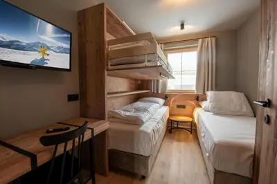 Ein Bett oder Betten in einem Zimmer der Unterkunft Filzsteinresort Wohnungen Top 4