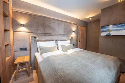 Ein Bett oder Betten in einem Zimmer der Unterkunft Filzsteinresort Wohnungen Top 4