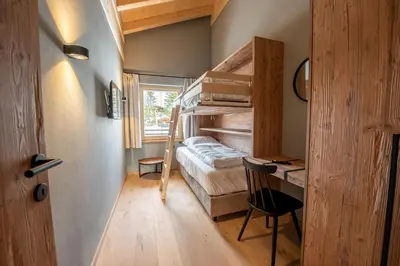Ein Bett oder Betten in einem Zimmer der Unterkunft Filzsteinresort Wohnungen Top 12