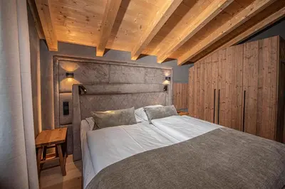 Ein Bett oder Betten in einem Zimmer der Unterkunft Filzsteinresort Wohnungen Top 11