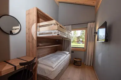 Ein Bett oder Betten in einem Zimmer der Unterkunft Filzsteinresort Wohnungen Top 11