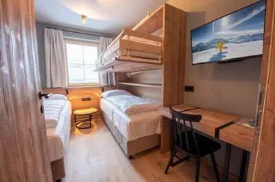 Ein Bett oder Betten in einem Zimmer der Unterkunft Filzsteinresort Wohnungen Top 10