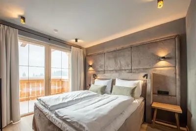 Ein Bett oder Betten in einem Zimmer der Unterkunft Filzsteinresort Wohnungen Top 7
