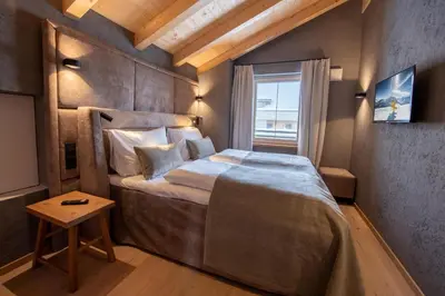 Ein Bett oder Betten in einem Zimmer der Unterkunft Filzsteinresort Wohnungen Top 5