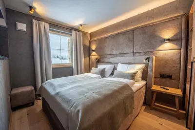 Ein Bett oder Betten in einem Zimmer der Unterkunft Filzsteinresort Wohnungen Top 6