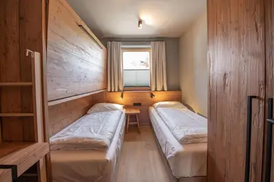 Ein Bett oder Betten in einem Zimmer der Unterkunft Filzsteinresort Wohnungen Top 8