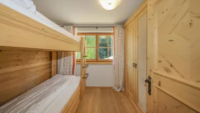 Ein Bett oder Betten in einem Zimmer der Unterkunft Chalet Bockberg - Ski in & out, Jacuzzi Sauna, Bergblick - by One Villas