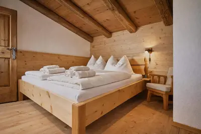 Ein Bett oder Betten in einem Zimmer der Unterkunft Haus ANTONIUS - by AlpenLuxus Collection