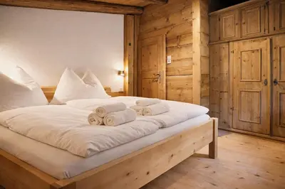 Ein Bett oder Betten in einem Zimmer der Unterkunft Haus ANTONIUS - by AlpenLuxus Collection
