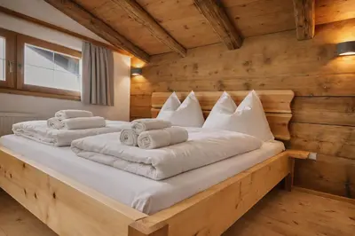 Ein Bett oder Betten in einem Zimmer der Unterkunft Haus ANTONIUS - by AlpenLuxus Collection